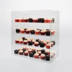 A cake display cabinet with four shelves holding a selection of cupcakes.