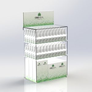 A countertop CBD display unit with an interchangeable graphics trap and different CBD products on display.