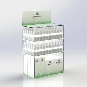 A countertop CBD display unit with an interchangeable graphics trap and different CBD products on display.