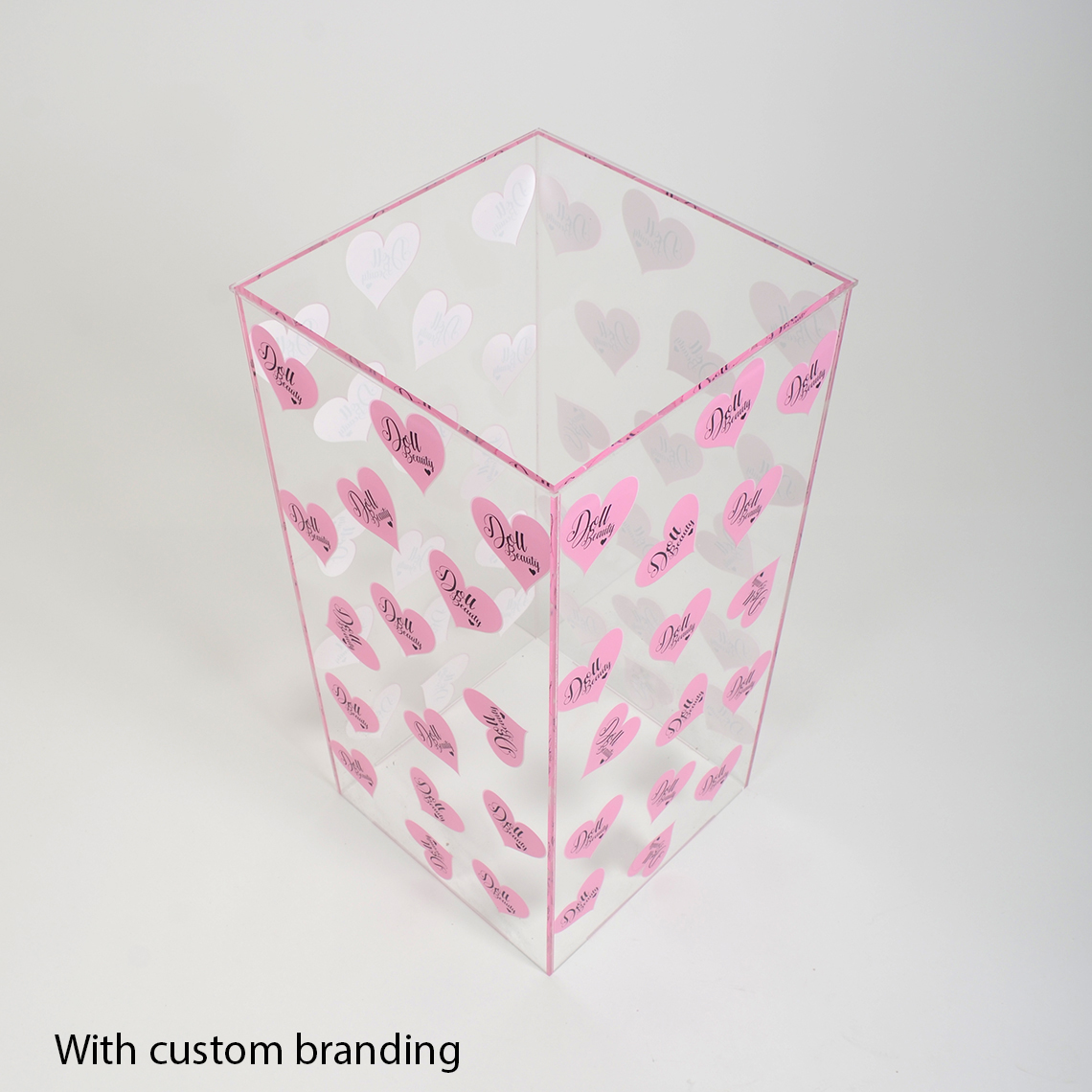 One Clear Acrylic Display Plinth With Pink Hearts Printed Onto The Sides.
