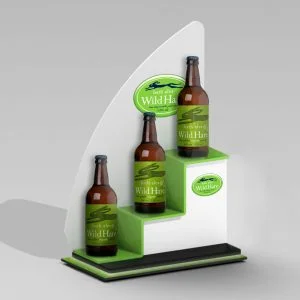 A custom white and green tiered back bar display with "bath ales wild hare" bottles on display.