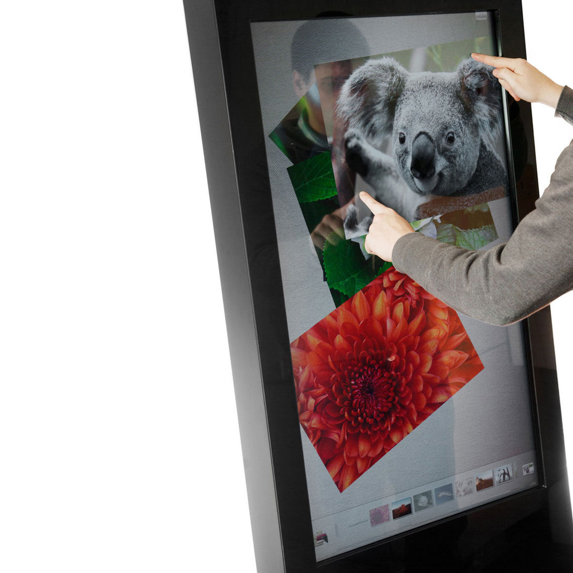 A close up of a black interactive digital touch screen totem.