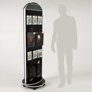 A black custom rotating totem display stand with hooks that are holding products.
