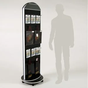 A black custom rotating totem display stand with hooks that are holding products.