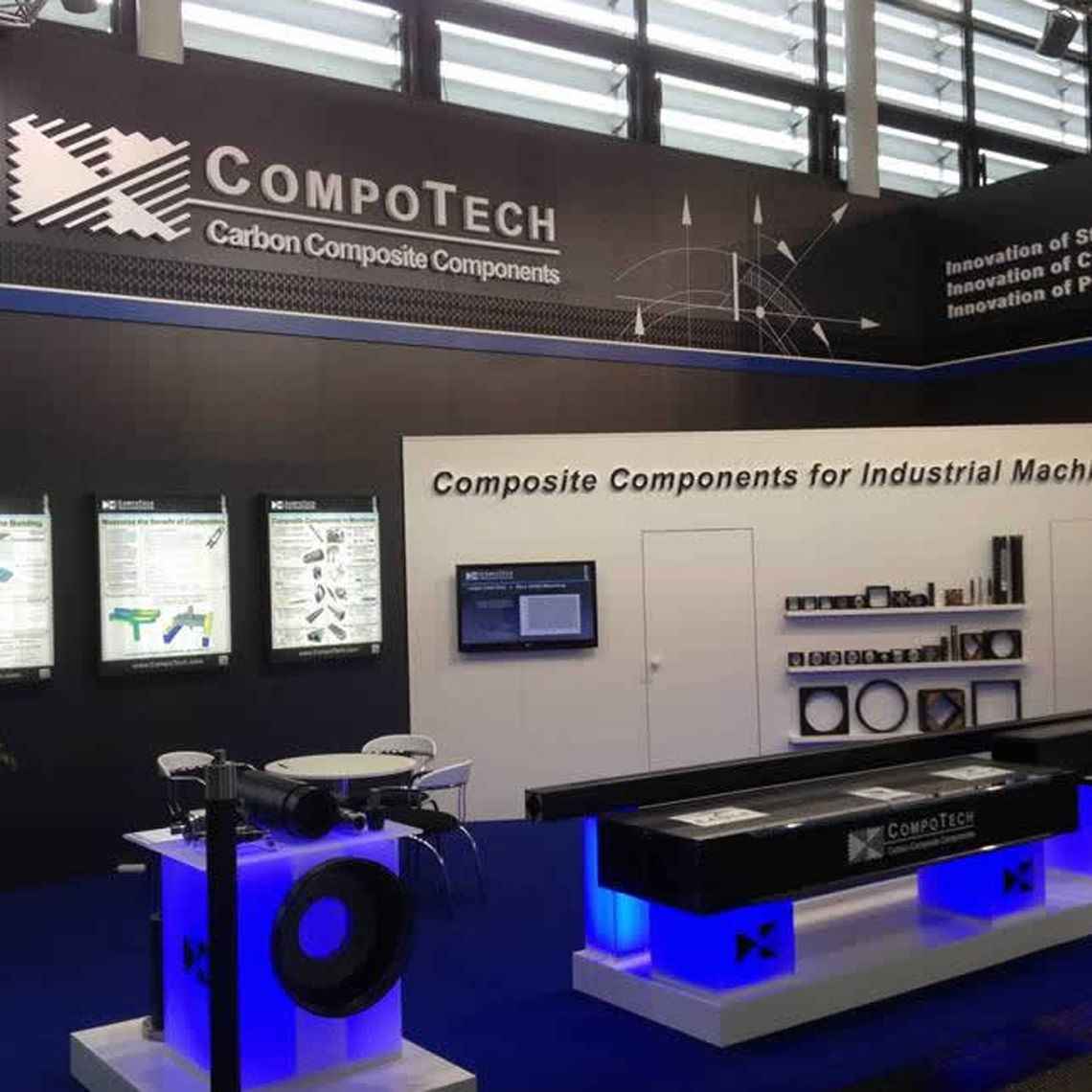 A blue, white and black illuminated exhibition display for ComptoTech.