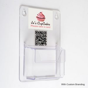 A wall mounted clear acrylic business card dispenser pocket with custom logo and QR code.