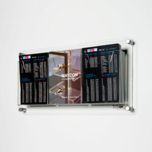 A wall mounted brochure holder with brochures on display.
