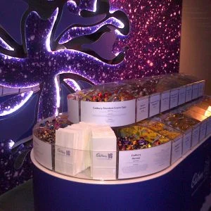 A bespoke pick and mix merchandiser with different cadburys chocolates inside.