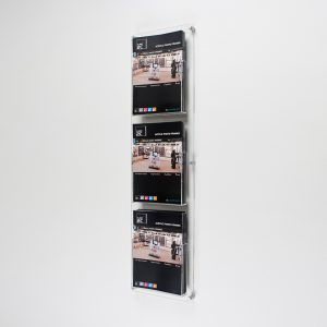 An acrylic brochure holder with 3 portrait slots.