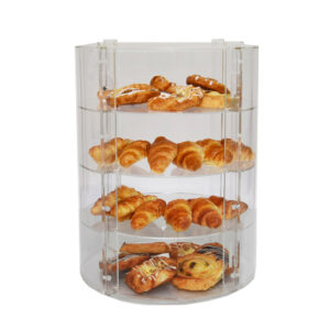 Circular display case with door with a selection of pastries on the shelves.