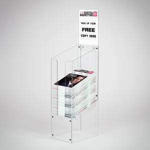 A clear acrylic dump bin with a header holding magazines.