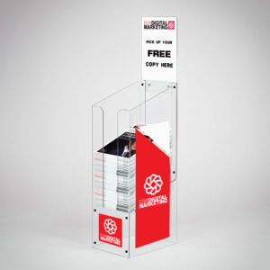 A custom printed, clear acrylic dump bin holding magazines with "EGR digital marketing logo printed on the front and sides.