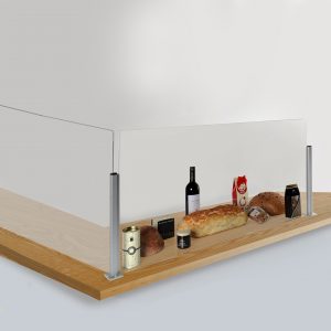 A corner counter sneeze screen with food and drink products behind it.