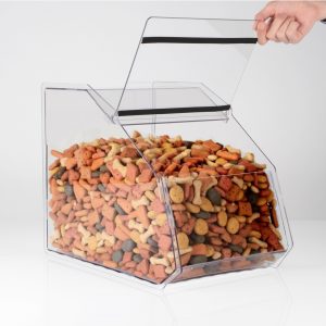 A clear acrylic PETG pet shop food bin with dog treats inside and a hand lifting the lid.