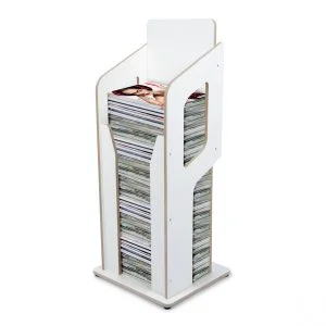 A white matt plywood magazine holder with magazines inside.