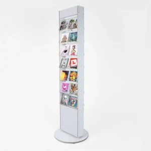 A white double sided, rotating card display holding cards.