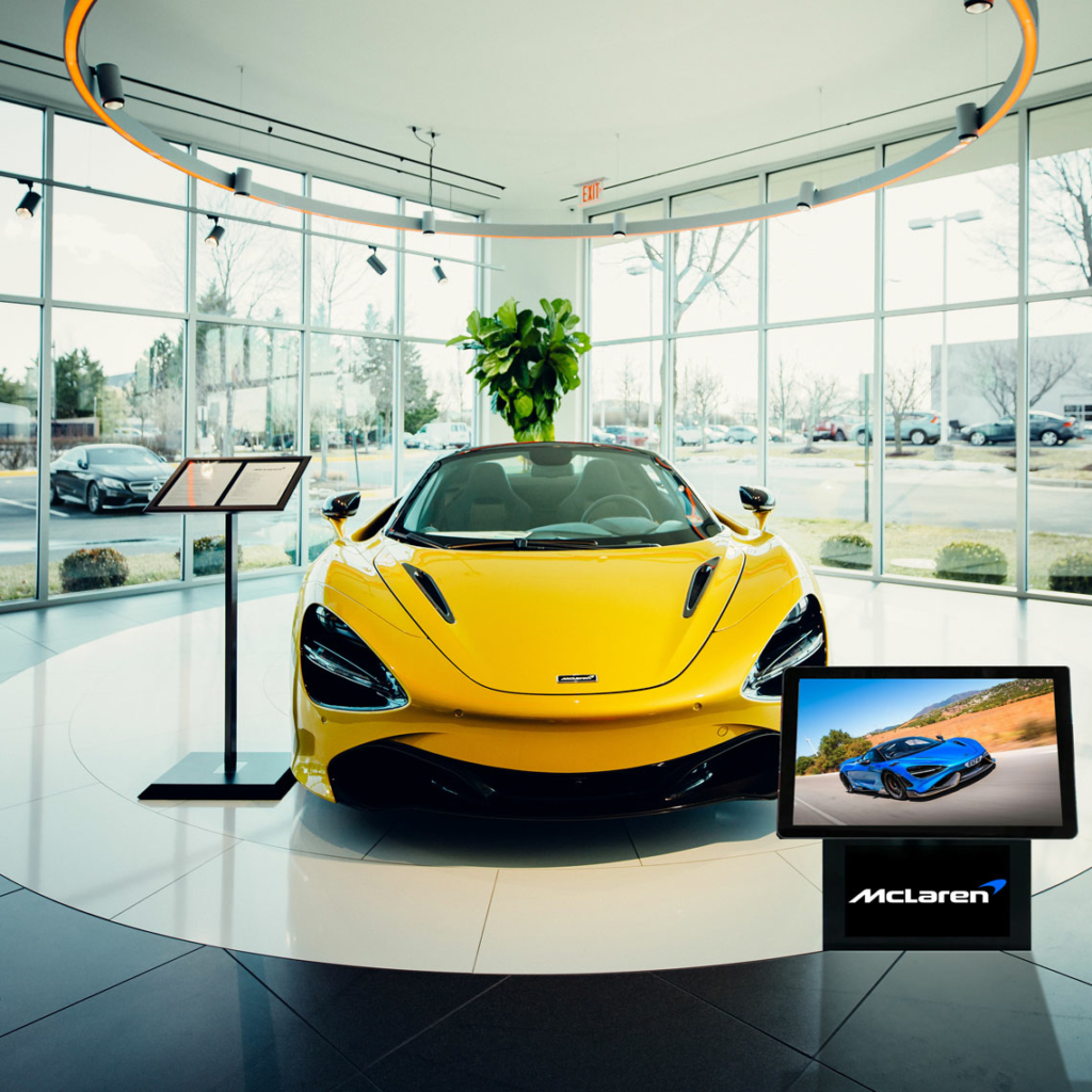 An Ultra Thin Digital Advertising Screen in a car showroom.