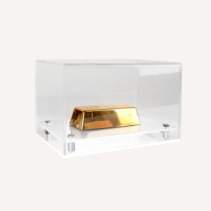 Model display case with clear top and white base with gold displayed inside.