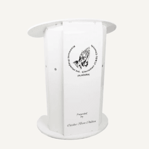 White presentation lectern with rounded top and base, with "Kosseuenti Prayerist Int. Christian (C&S) Church (Aldura)" logo on the front.