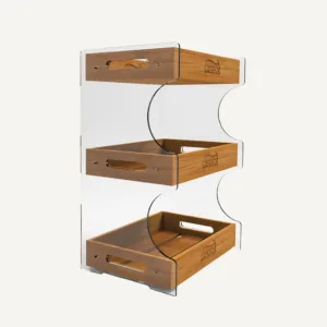 A clear acrylic and wood tiered confectionary display with a walkers logo on the front of the shelves.