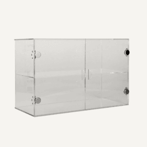 A clear acrylic counter display cabinet with shelf, doors and magnetic latches.