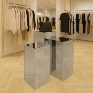 Three different hight Silver Mirror Plinth pedestals In a retail shop display.