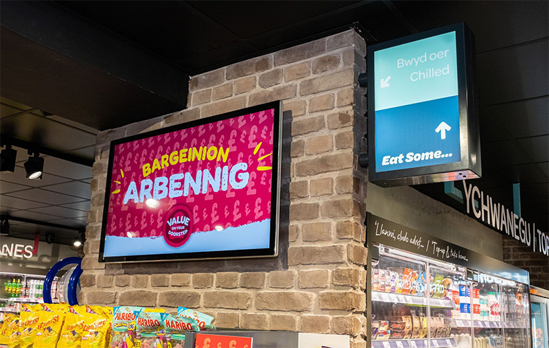 An Ultra Thin Digital Advertising Screen on a shop wall.