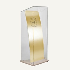 Clear curved acrylic horizon lectern with gold brushed central panel, with "margarita Hotel & Resort" logo.