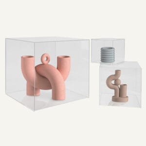 Three different sized acrylic display cubes with sculptures inside.