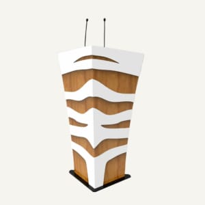 Zebra print white and wooden lectern with black base and two black microphones.