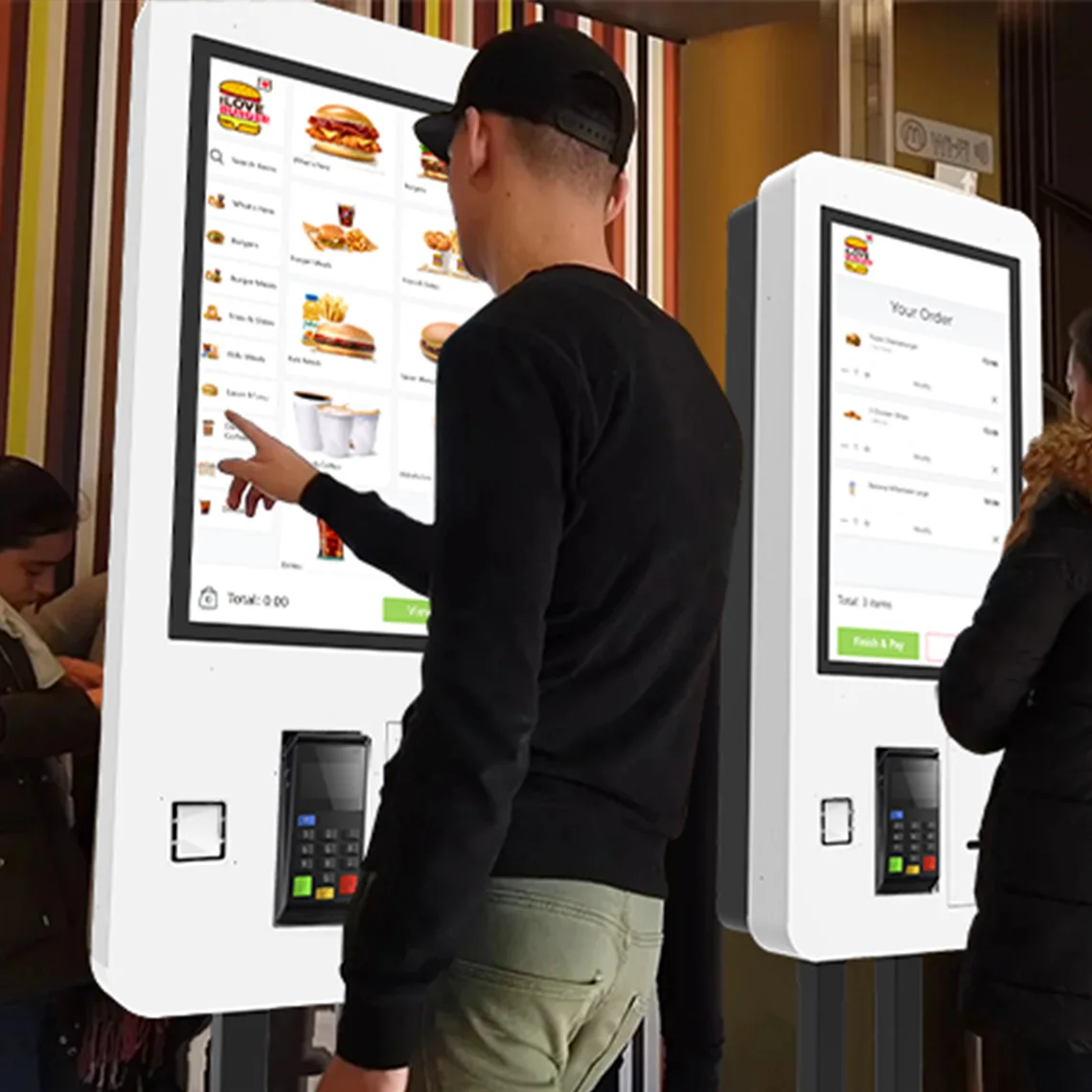 A man using a Fast Food & Restaurant Self Ordering Kiosk.