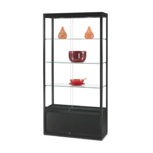 A black cabinet with sliding doors and ornaments inside.