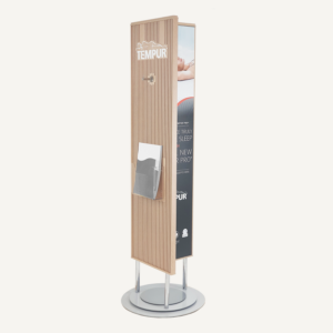 A rotating POS display with a chrome base and plywood finish. It features an acrylic brochure holder, Tempur logo, chrome hook and other branding.