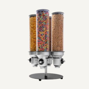 A silver countertop rotating cereal dispenser with different cereals.