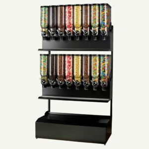 A front facing view of a black and clear freestanding bulk candy dispenser with 16 containers full of different sweets.