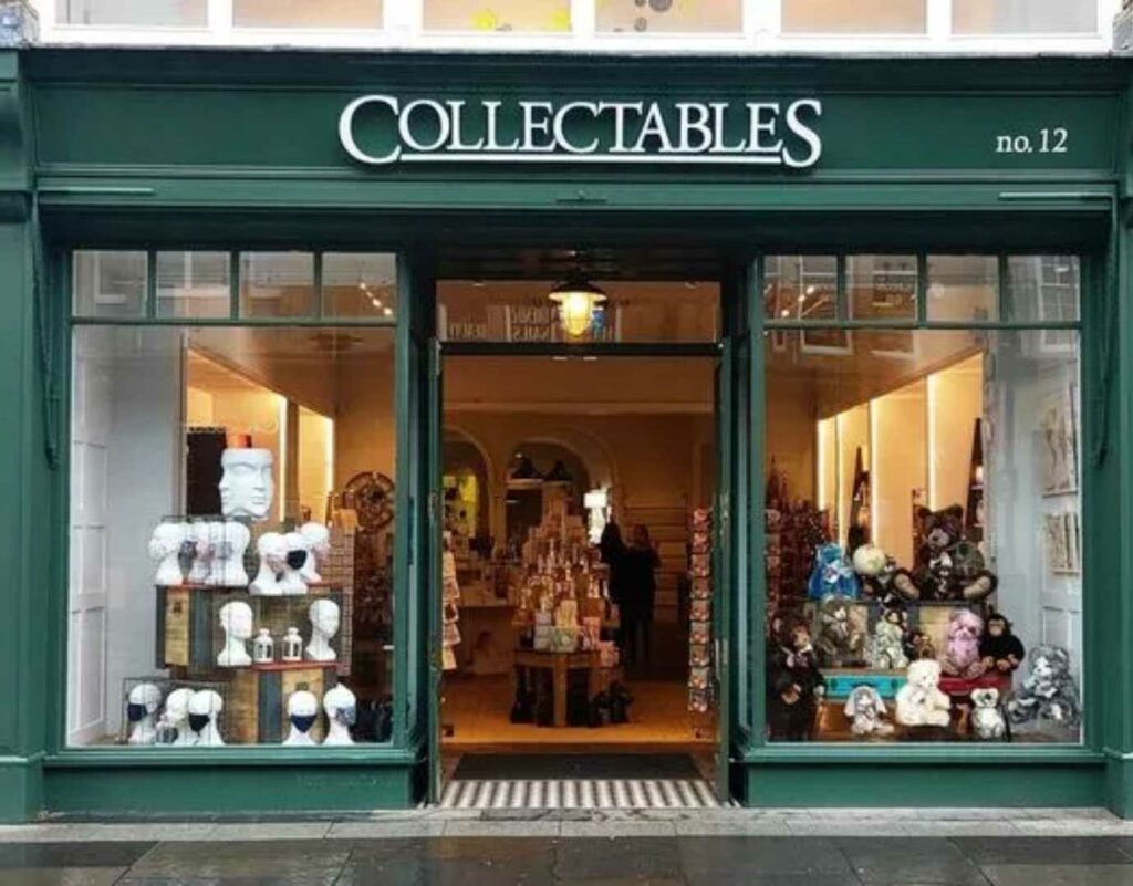 A green shop window with a "Collectables" sign.