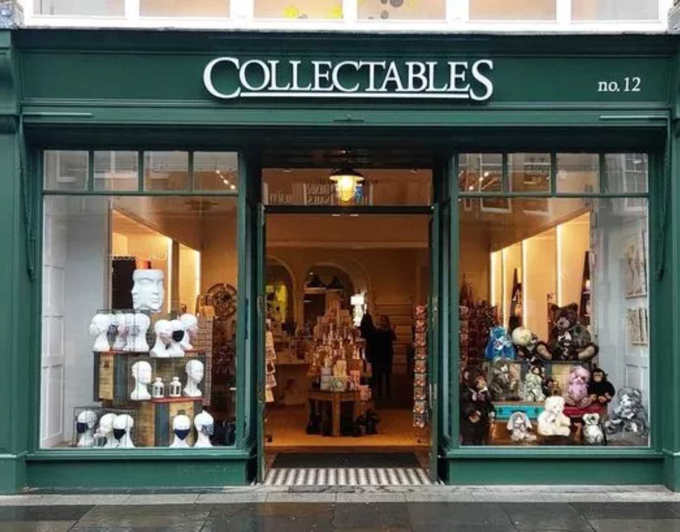 A green shop window with a "Collectables" sign.