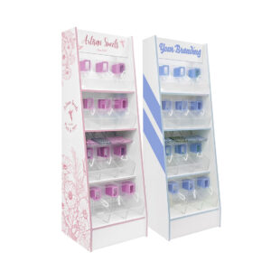 One pink pick and mix stand with pink scoop bins, and one blue pick and mix stand with blue scoop bins. Both with custom branding.
