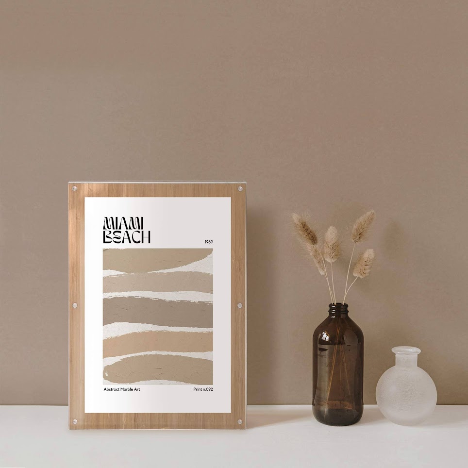 A bamboo frame next to a vase with a brown wall background.