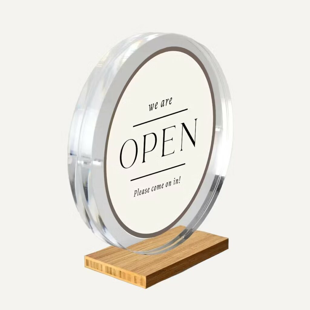 A magnetic circular frame with a wooden base.