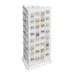 A rotating countertop jewellery display holding different earrings.