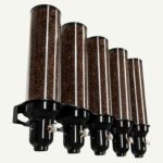 A wall mounted coffee bean dispenser with 5 cylinders.