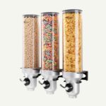 A wall mounted cereal dispenser with different cereals inside.