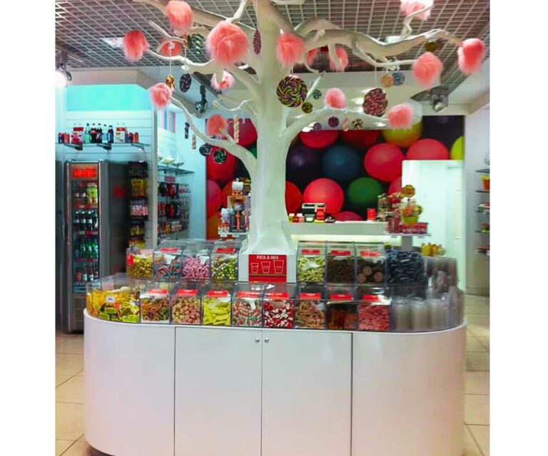 A custom pick and mix display with a decorative tree in the middle.