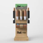 A zero waste freestanding custom gravity dispenser with different dry foods inside.