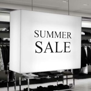 A ceiling mounted lightbox with "summer sale" written on.
