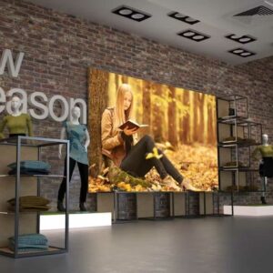 A large indoor advertising lightbox in a clothes shop.