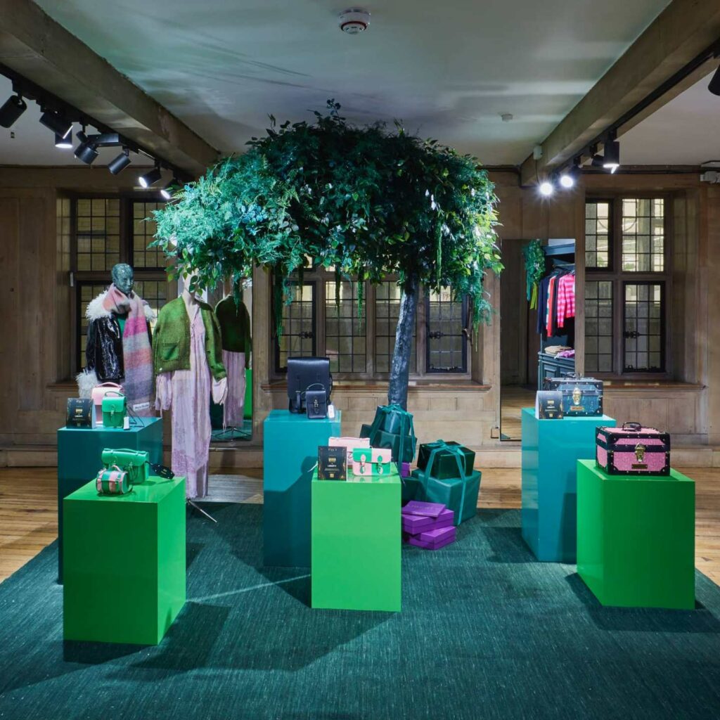 A green and blue themed retail display with matching plinths.